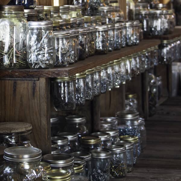 Row_of_mason_jars_suspended_by_the_lids